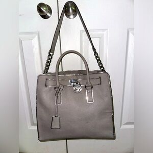 Silver Michael Kors crossbody/satchel with lock and key